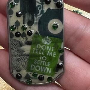 Dog tag resin necklace "Don't tell me to settle down" green embellished.